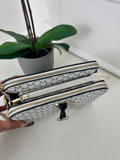 White M design cross body bag