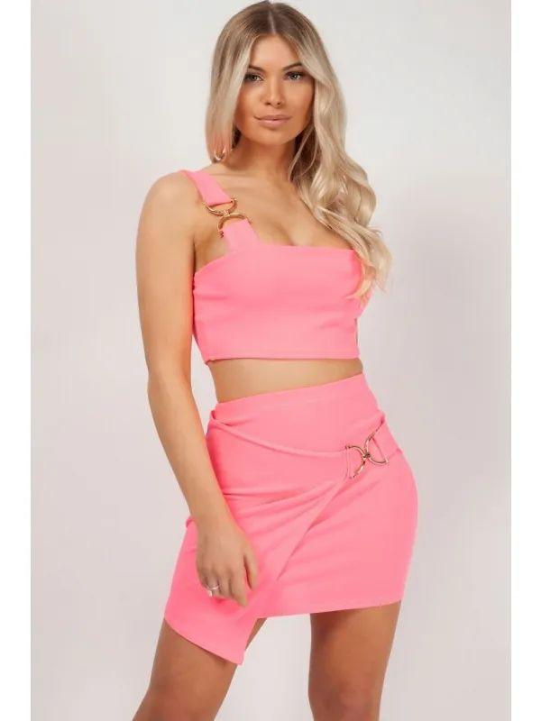 pink two piece gold buckle skirt and crop