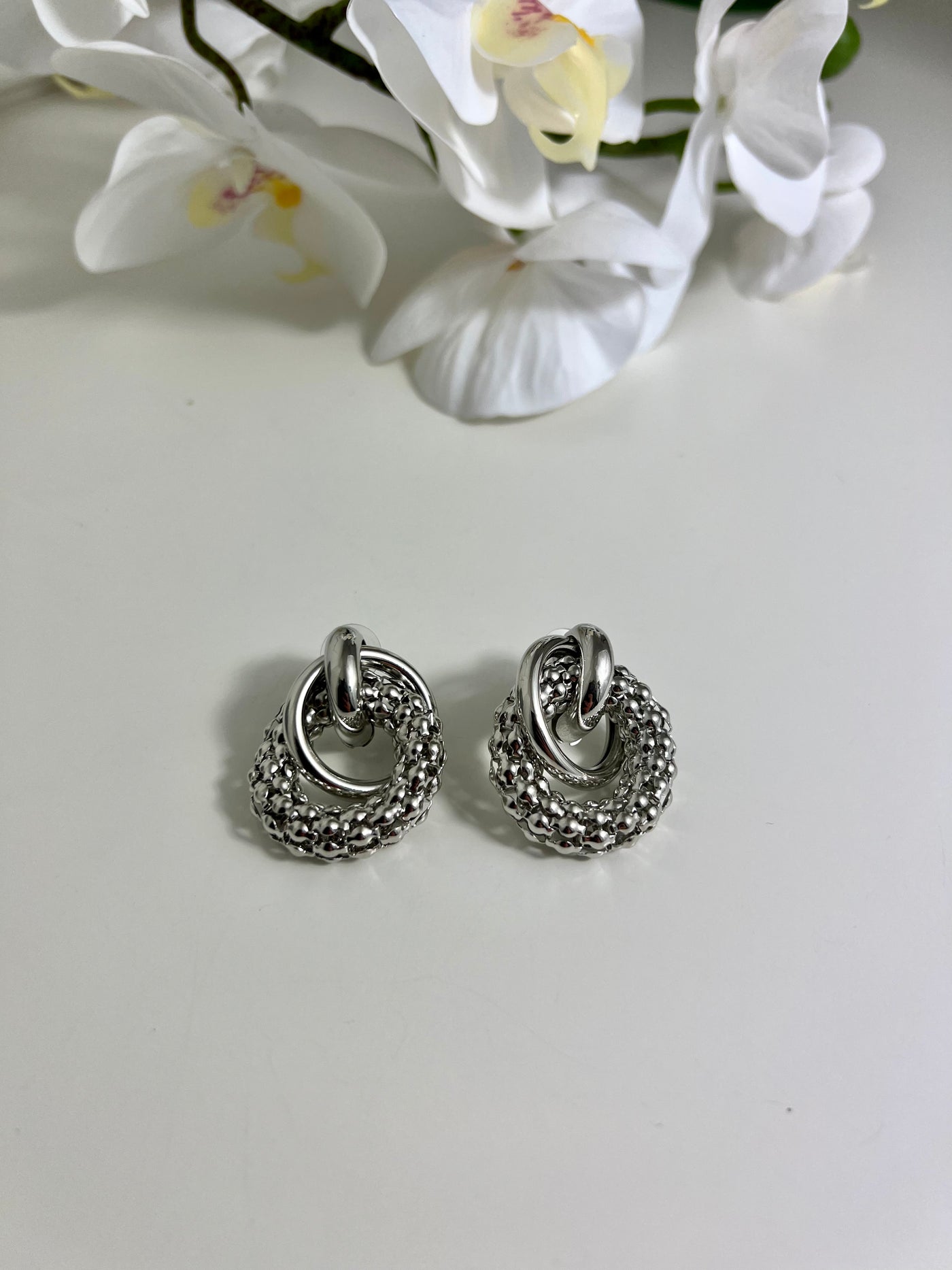 silver textured stud tube design earrings