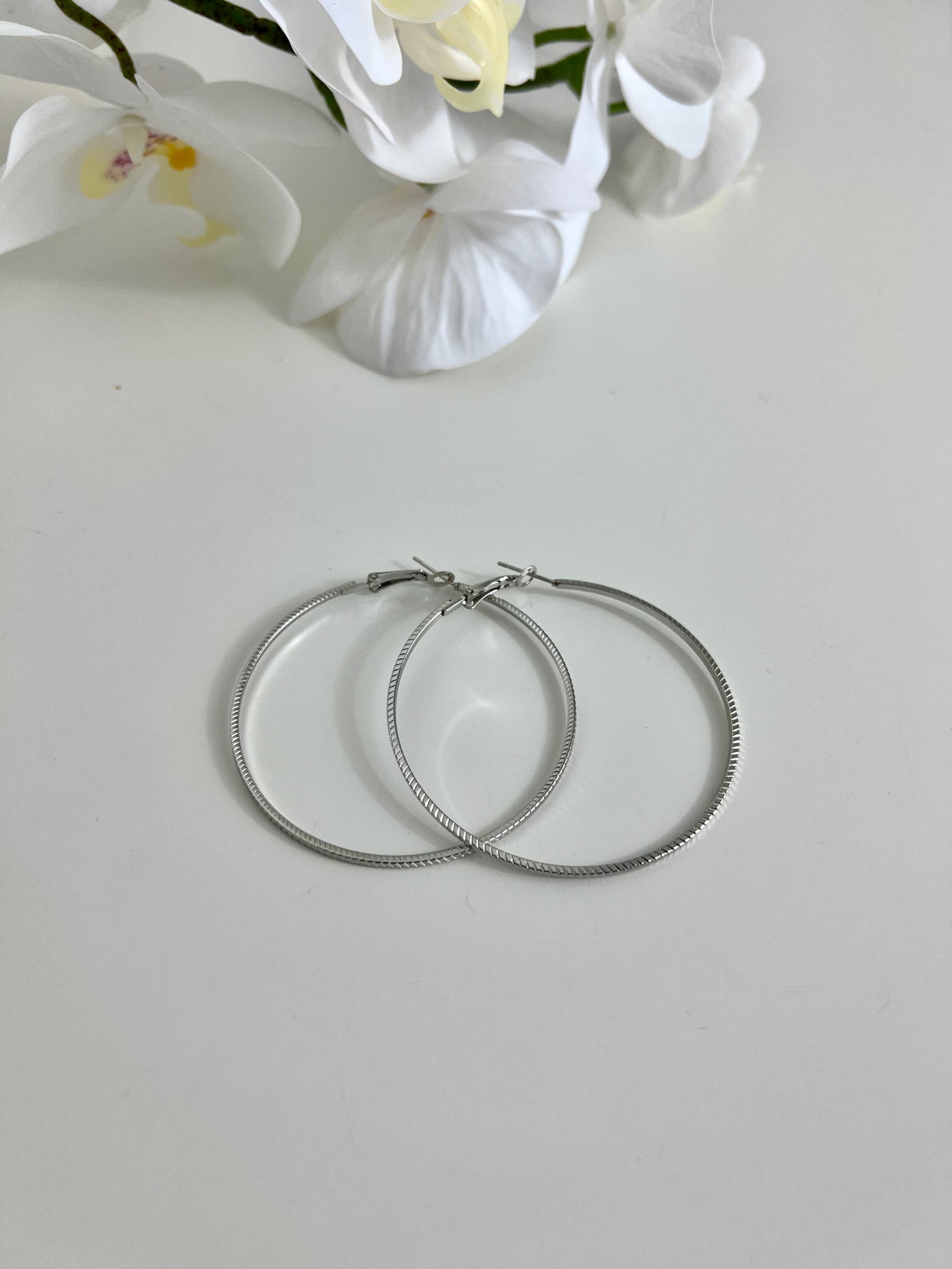 Silver twist detail hoop earrings