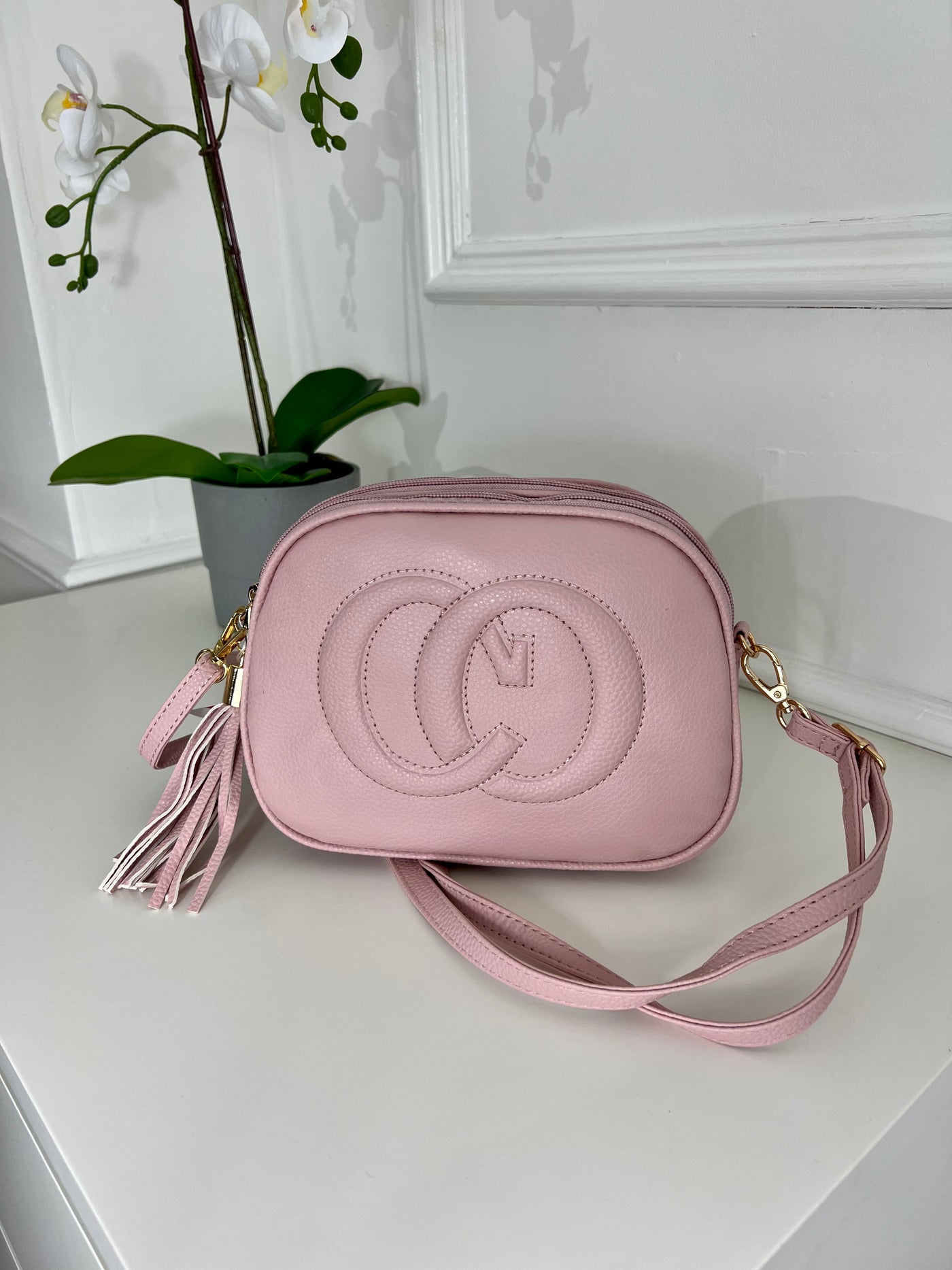 Pink CO embraided cross bag with tassel