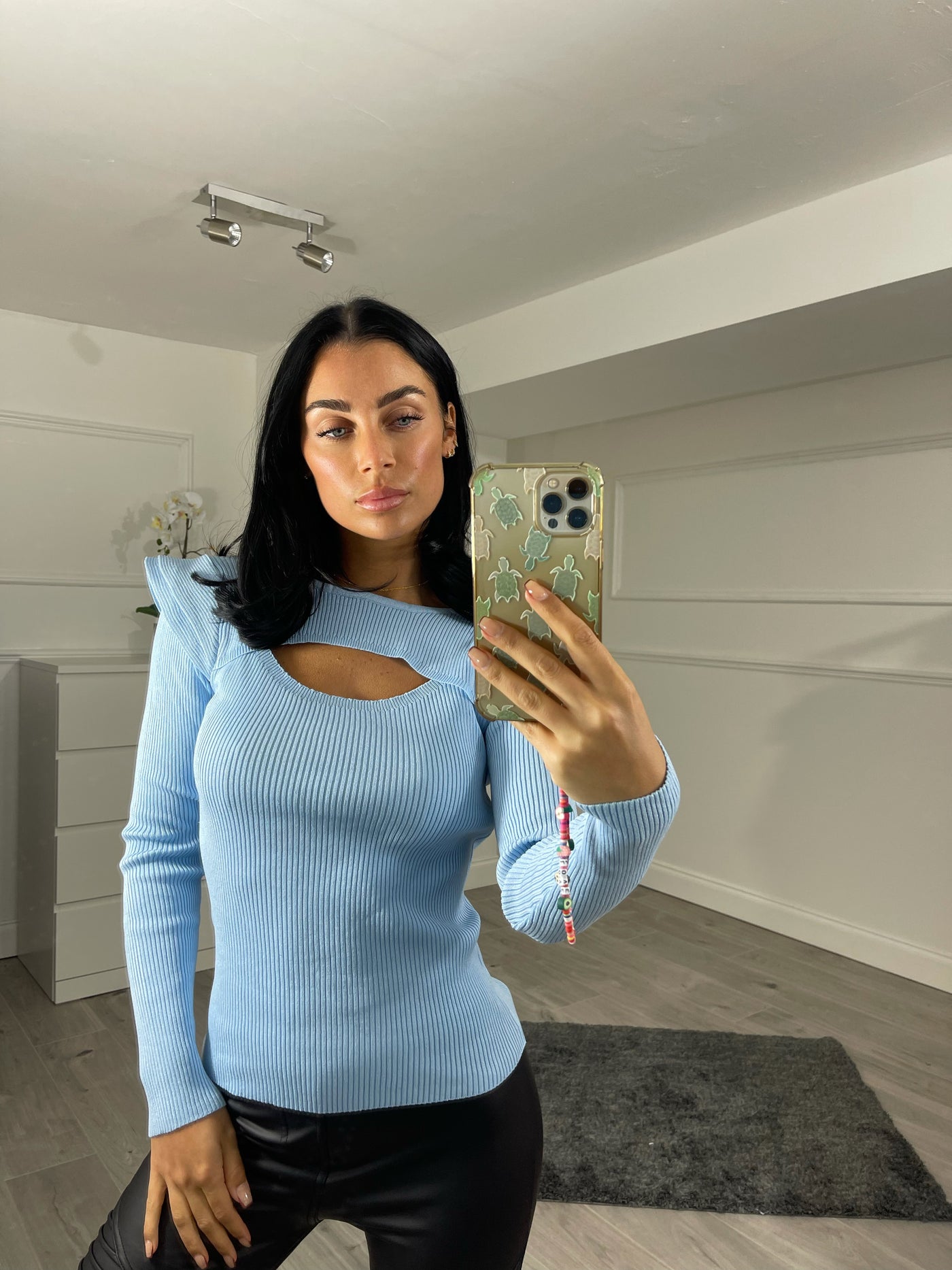 Light blue flare shoulder cut out jumper