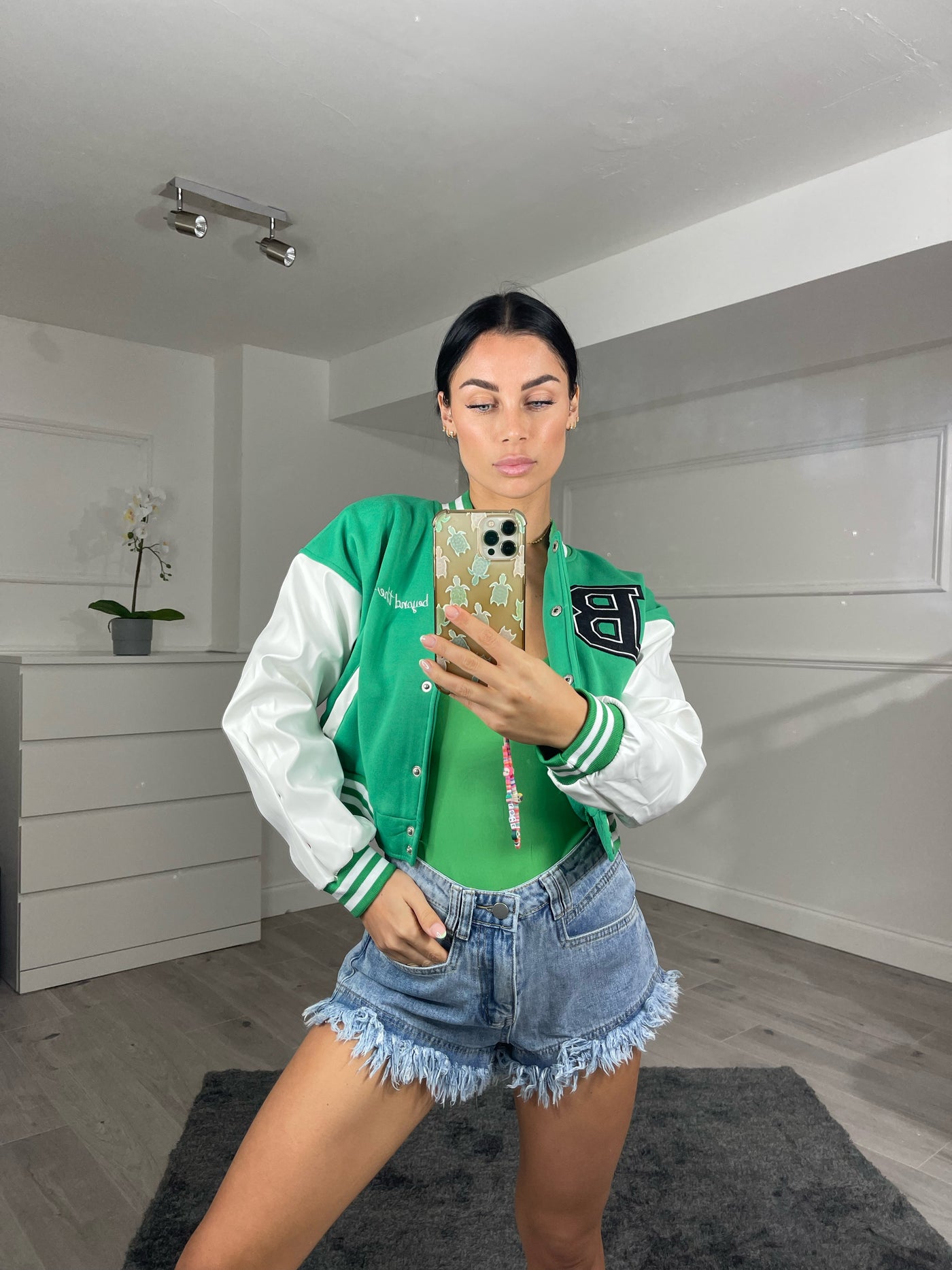 green cropped varsity jacket