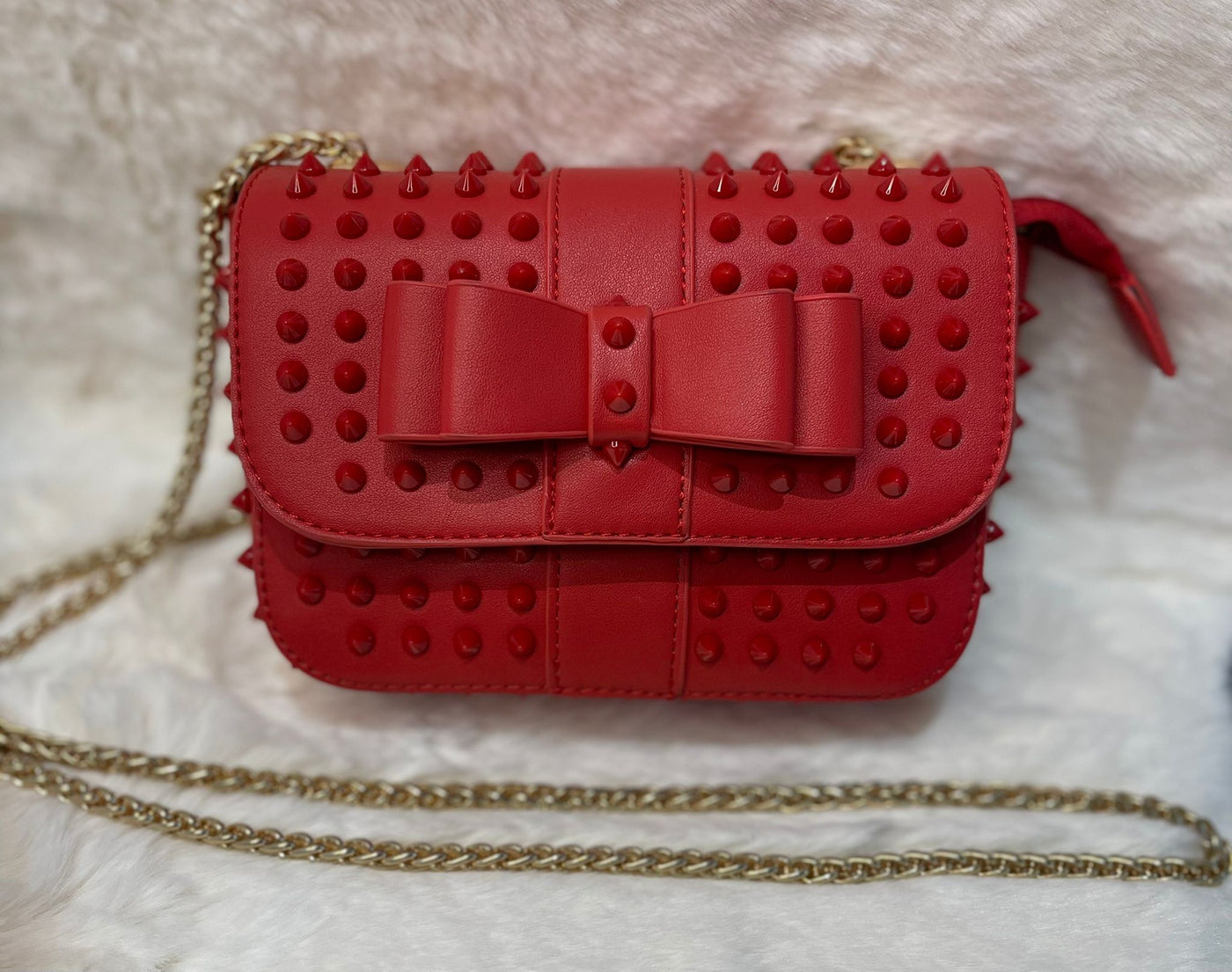 Red studded bow detail cross body bag